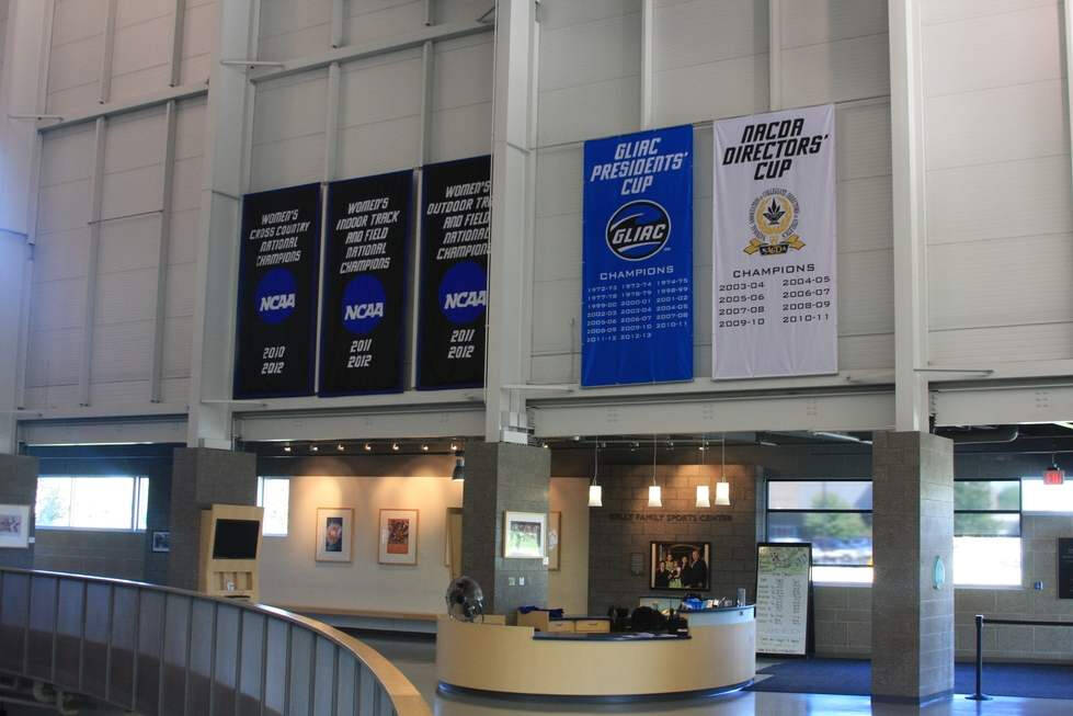 laker banners for sports hung on the wall of an arena